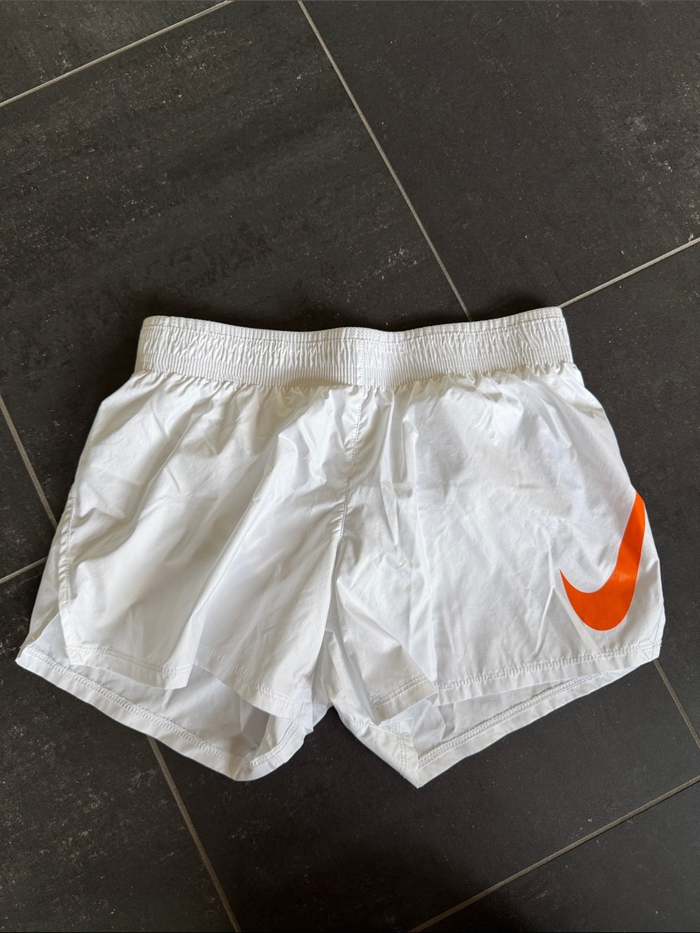 Nike Women’s White Athletic Shorts with Orange Swoosh size XS